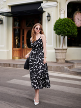 A girl wears a silk iris printed dress